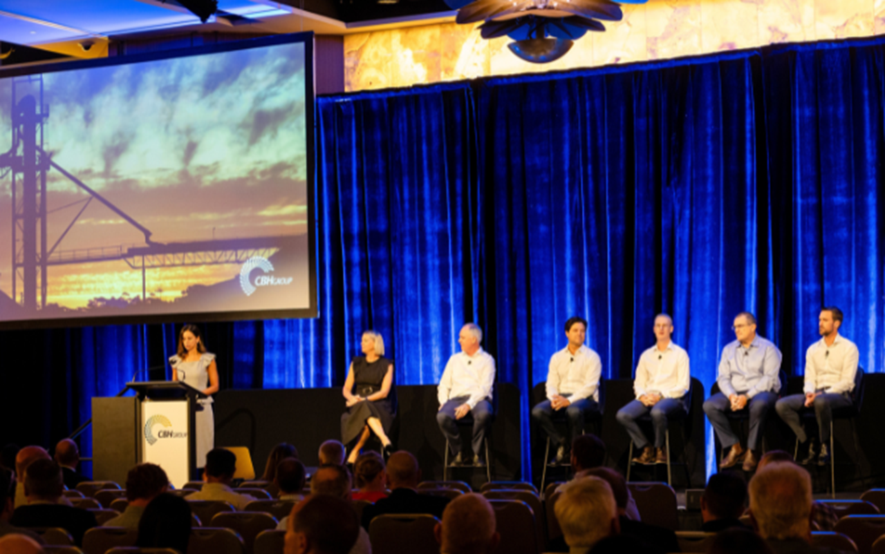 Panel of speakers on stage