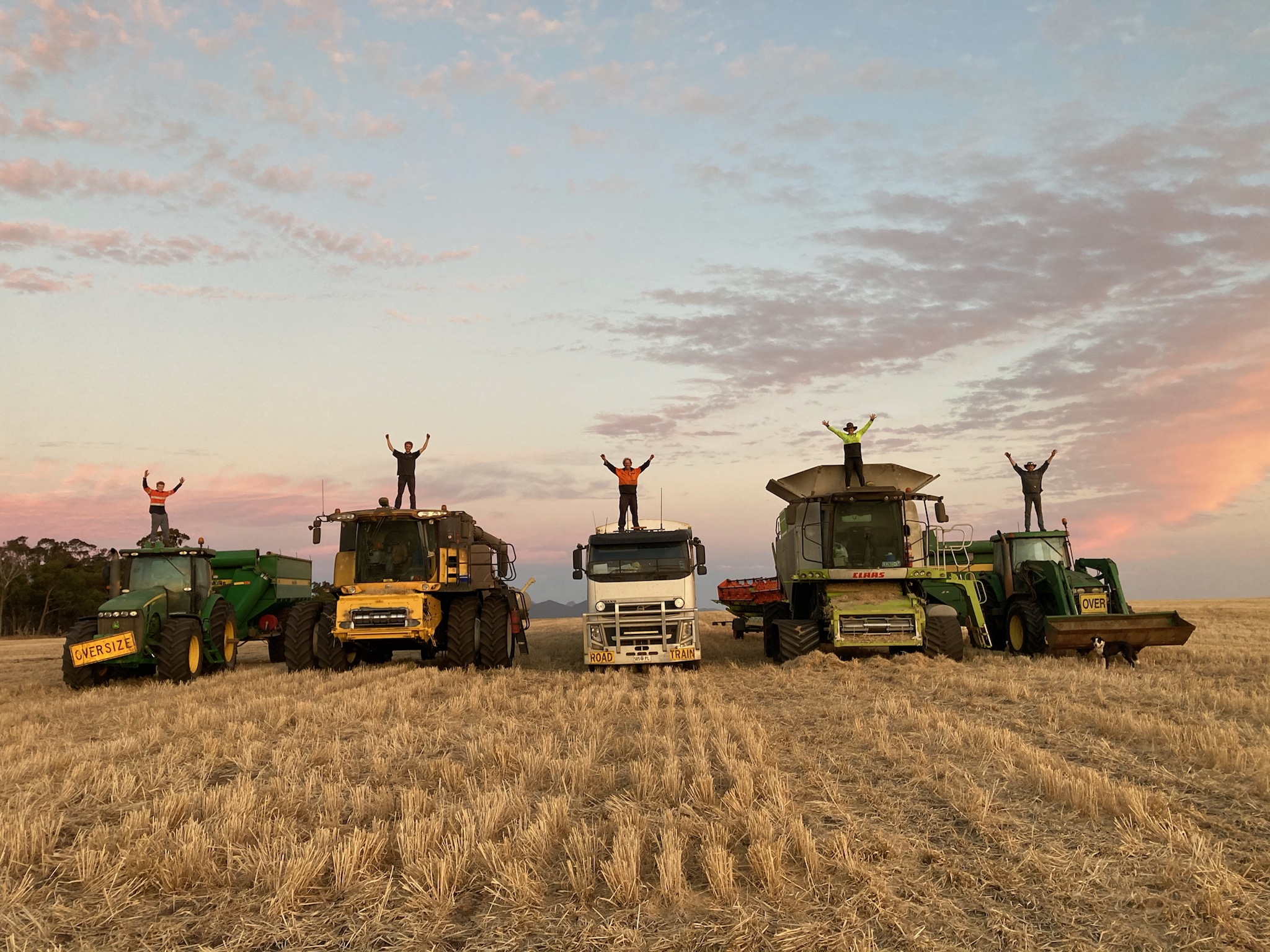 Growers standing on their trucks