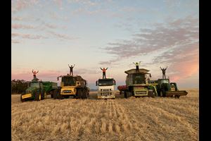 Growers standing on their trucks