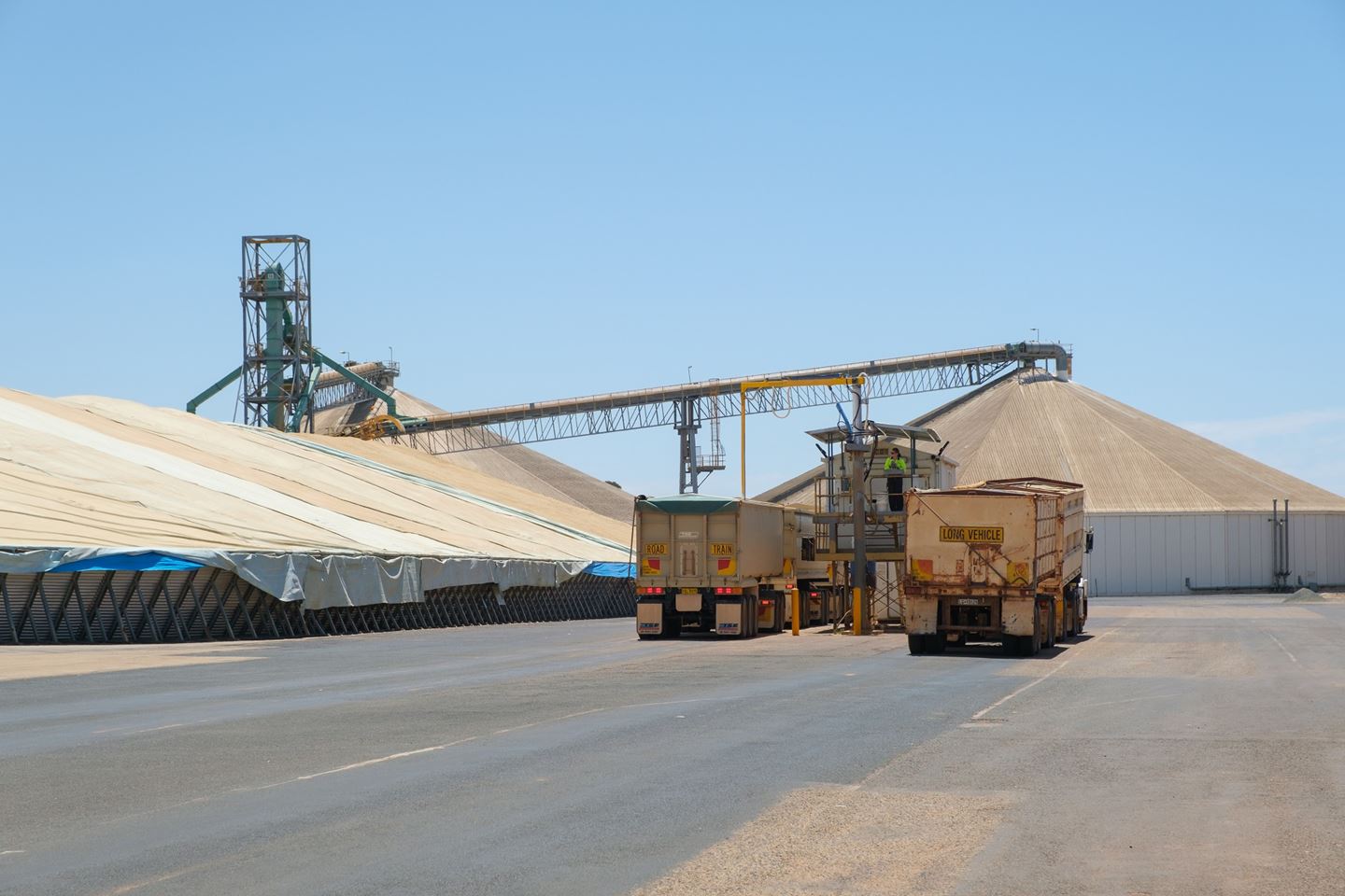 Two trucks lining up at the CBH site sample hut to be sampled at harvest