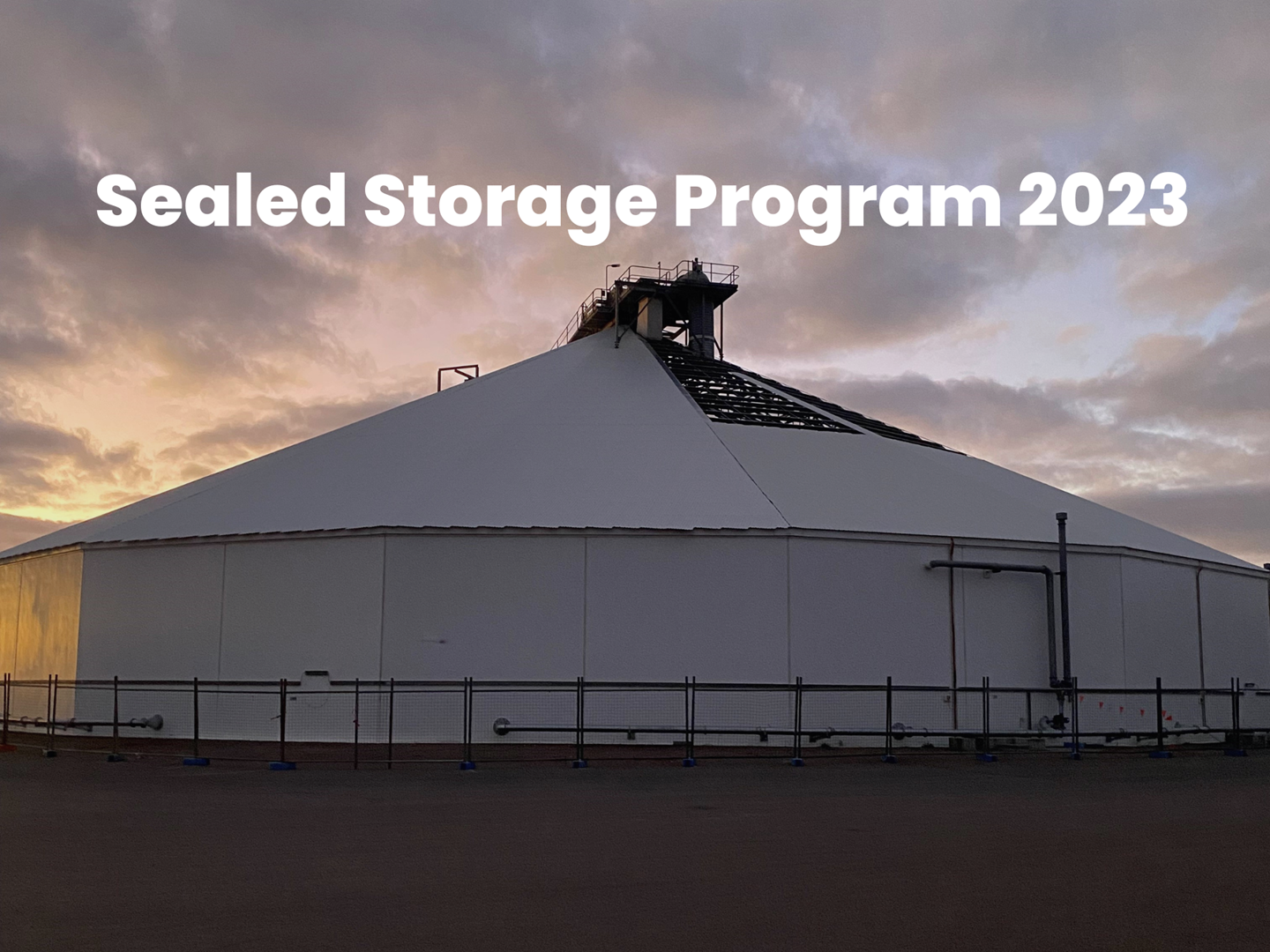 Image of a circular storage at sunset with the text "Sealed Storage Program 2023" on it.