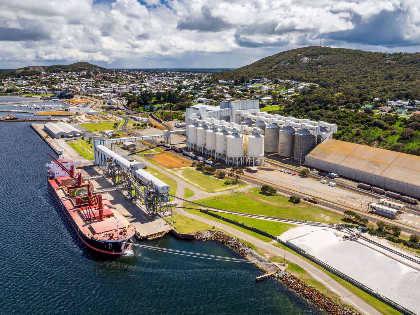 CBH Albany Port with green hill and blue skies in the background