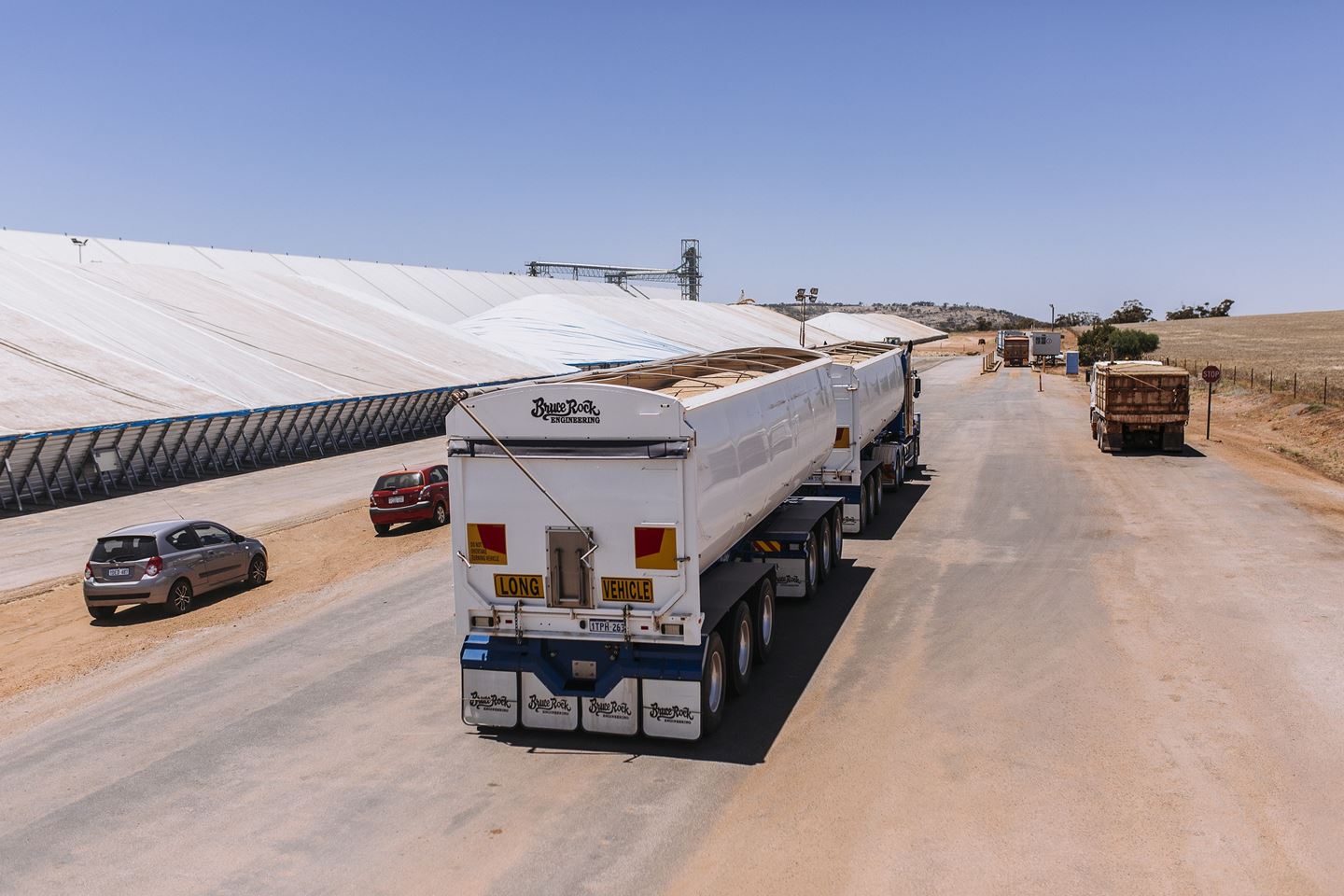 A truck drives through a CBH receival site at harvest